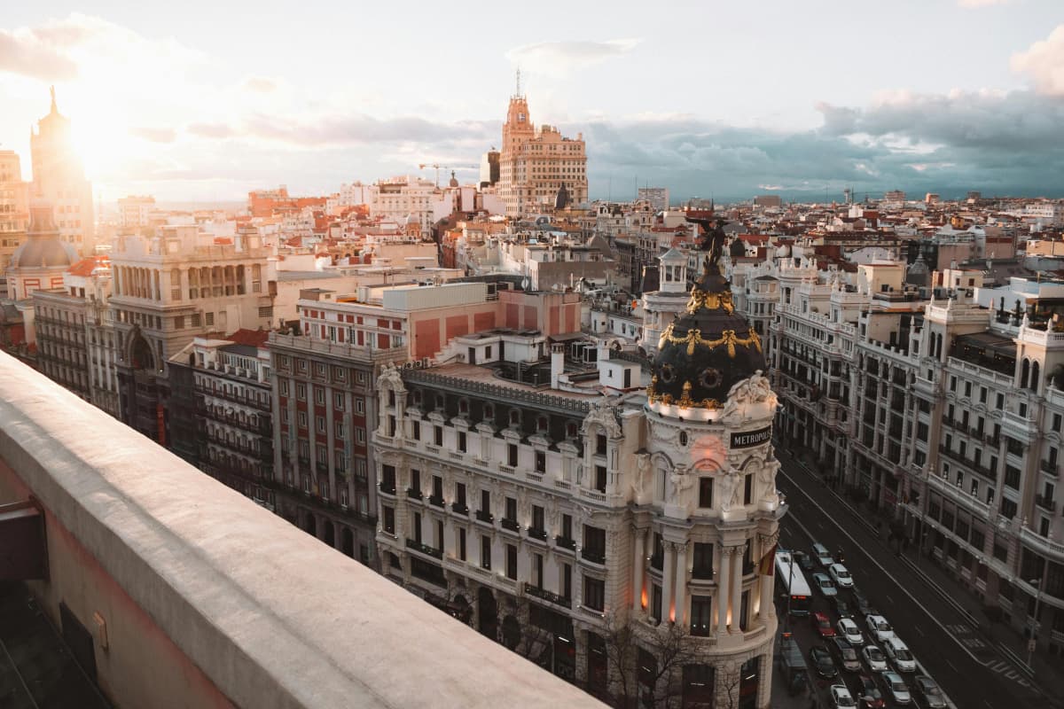 International professionals in Spanish business training with Madrid skyline view